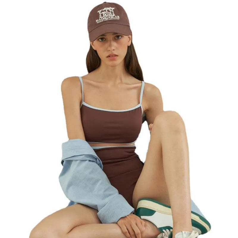 Brown women's one-piece triangle swimsuit showing front design on mannequin