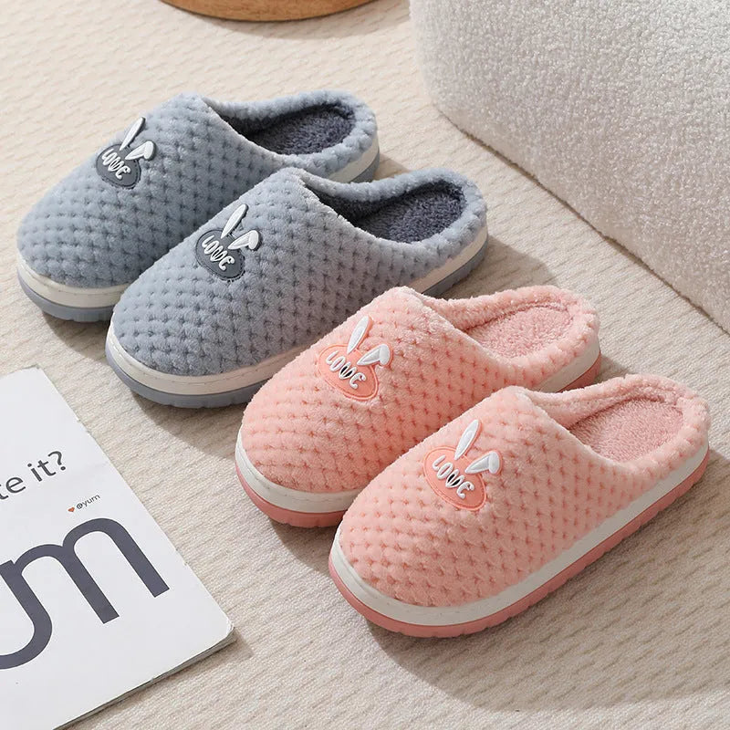 Women's rabbit plaid design artificial fur slippers with a thick rubber sole in various colours.