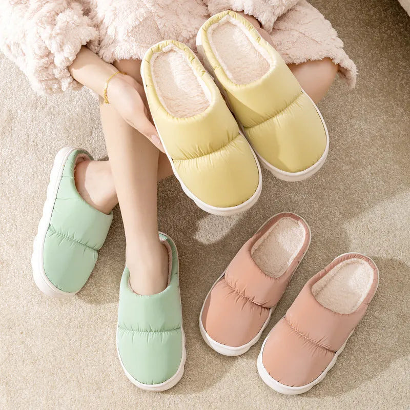 Blue down cotton slippers with artificial leather uppers, thick rubber soles, and plush lining for indoor winter wear.