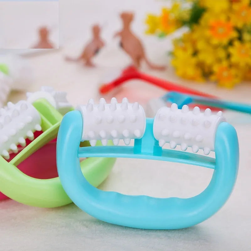 Handheld anti cellulite massager roller with blue dot wheel on white background, 13.5x8.5cm