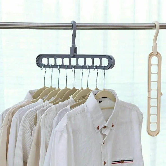 Plastic clothes hanger with a white hook on a pink background, showing its 33 cm length and rotatable handle.