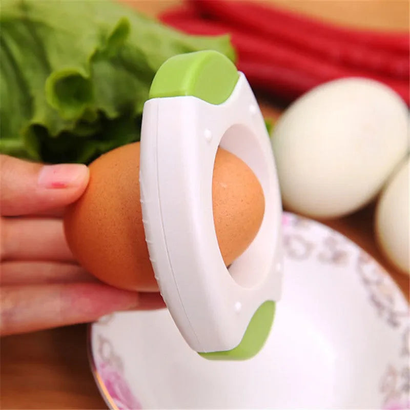 Manual kitchen egg opener with stainless steel cutting edge in green colour, dimensions 8.3 by 5.7 by 1.8 cm