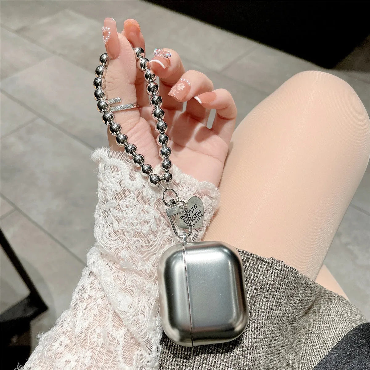 Matte plating AirPods protective case with electroplated bracelet-style details on TPU material