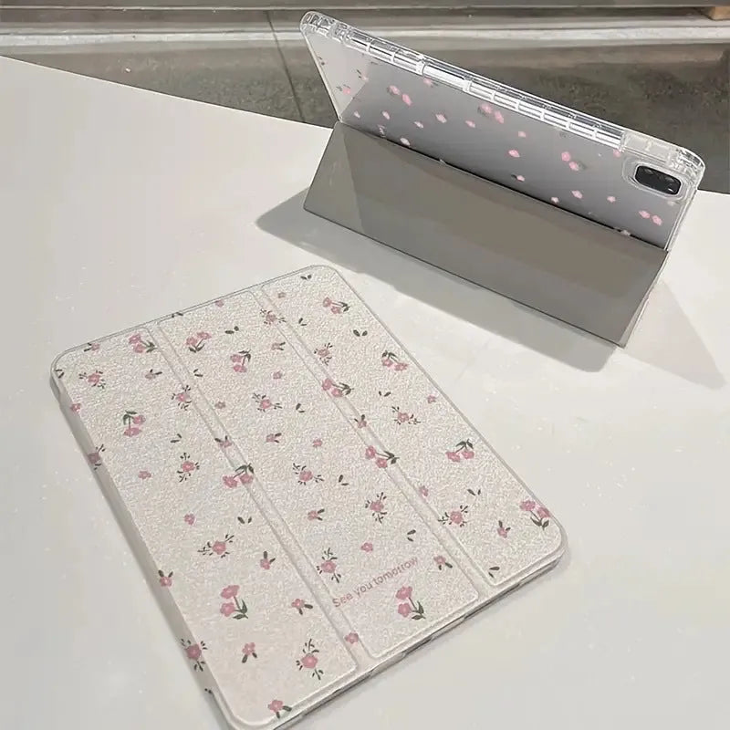 Transparent floral tri-fold iPad case showing magnetic stand function and clear polycarbonate construction