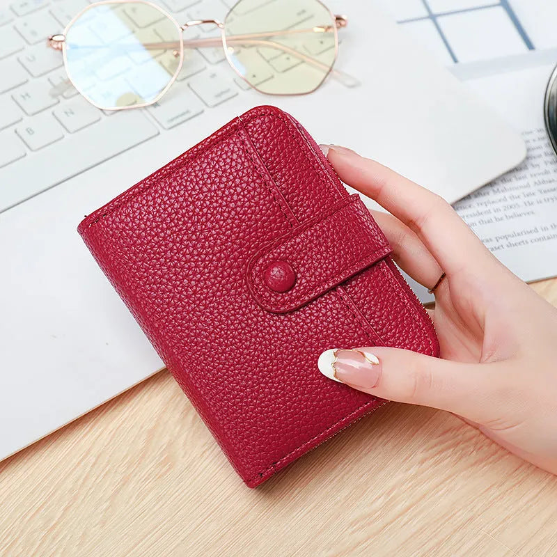 Ladies short wallet with lychee pattern in synthetic pu leather showing 2-fold design