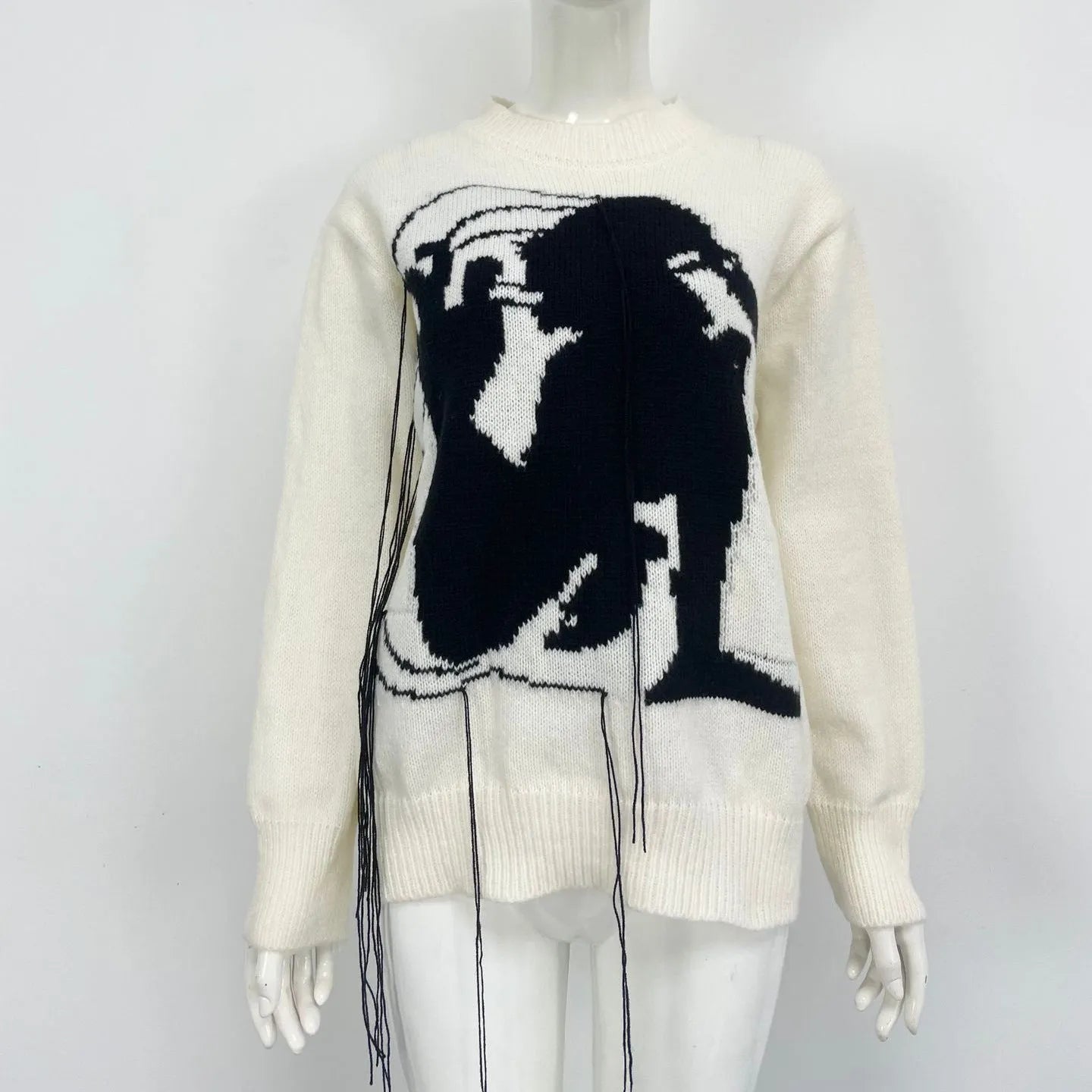 Women's loose grey alpaca wool pullover sweater with tassel detailing and round neck