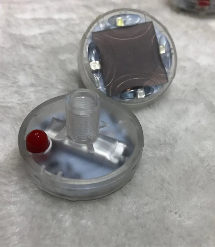 Solar-powered LED valve light for car or motorcycle wheel hub with colourful flashes.
