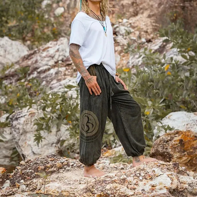 Men's dark green ethnic pattern trousers with ankle-tied design on mid waist