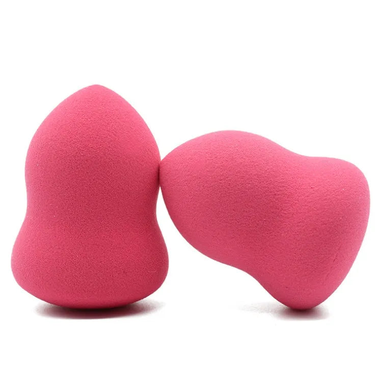 Pink square makeup blending sponge on a white background.