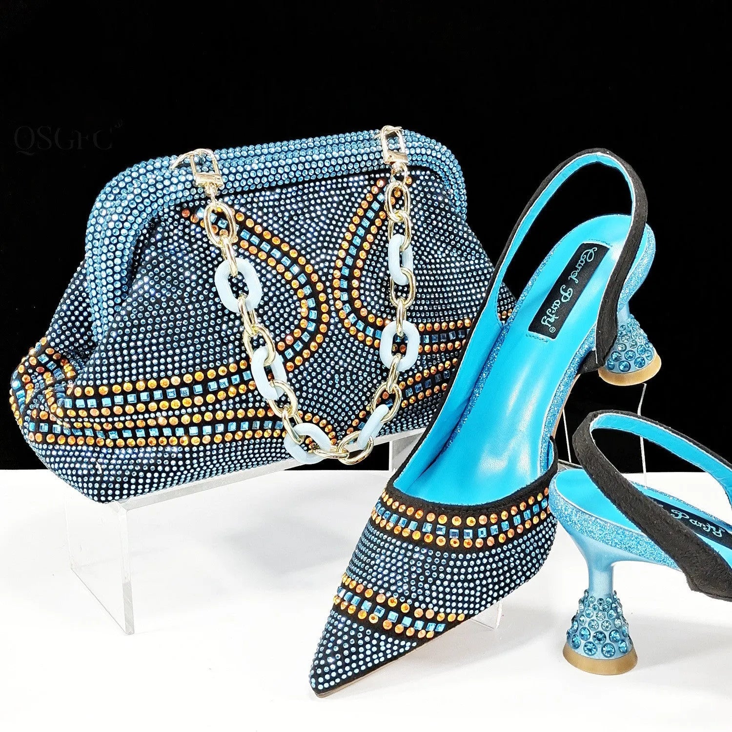 Women's pointed toe high heel shoes with matching bag, stiletto heel, rhinestone detail, on a colour selection background.