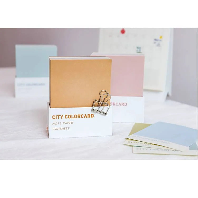 Set of rectangular 75x95mm paper memo notes with creative city colour designs in an OPP bag.