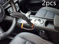Red car steering wheel lock with steel cable secured on a steering wheel.