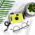 Lomo underwater waterproof film camera in assorted colours including pink, blue, and robot cat design.