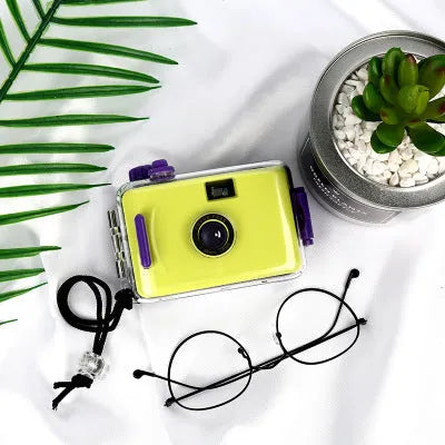 Lomo underwater waterproof film camera in assorted colours including pink, blue, and robot cat design.
