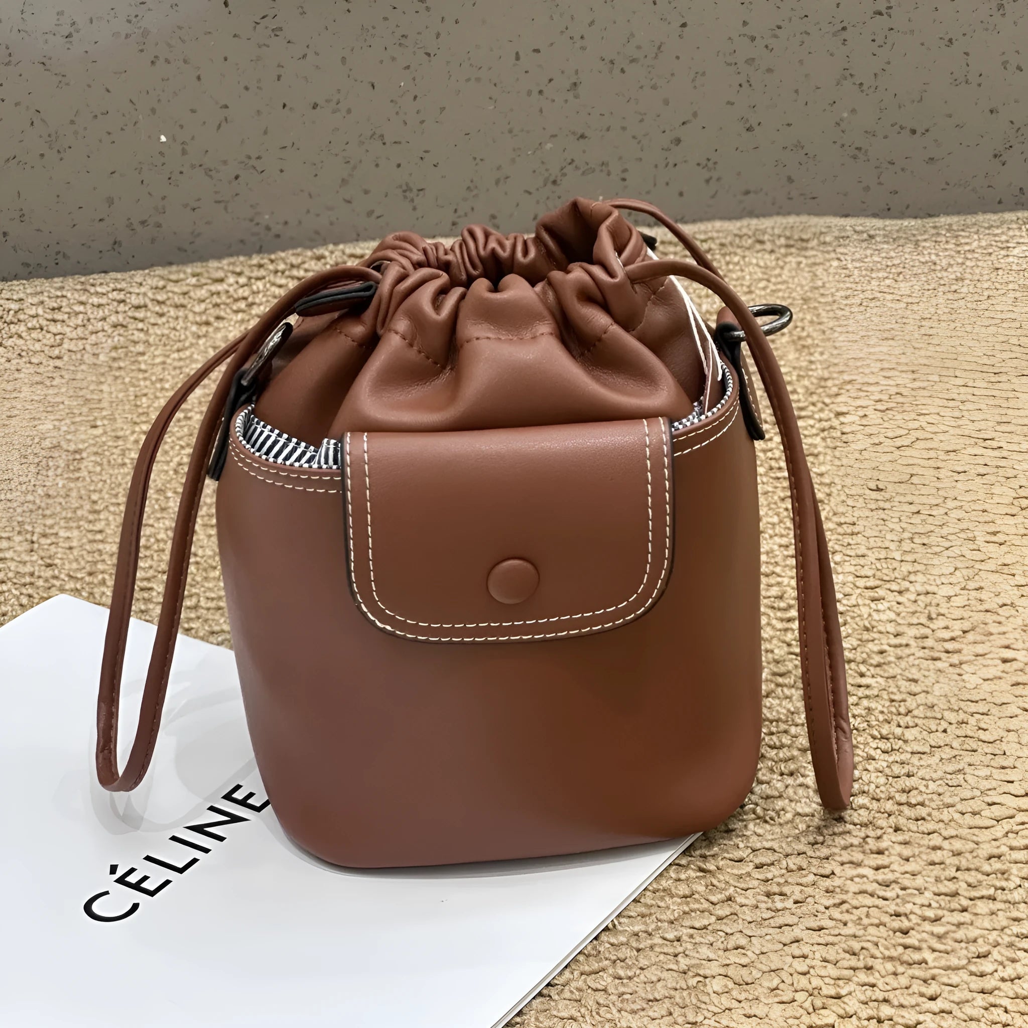 Cortex women's genuine leather drawstring bucket crossbody bag in brown with patchwork design