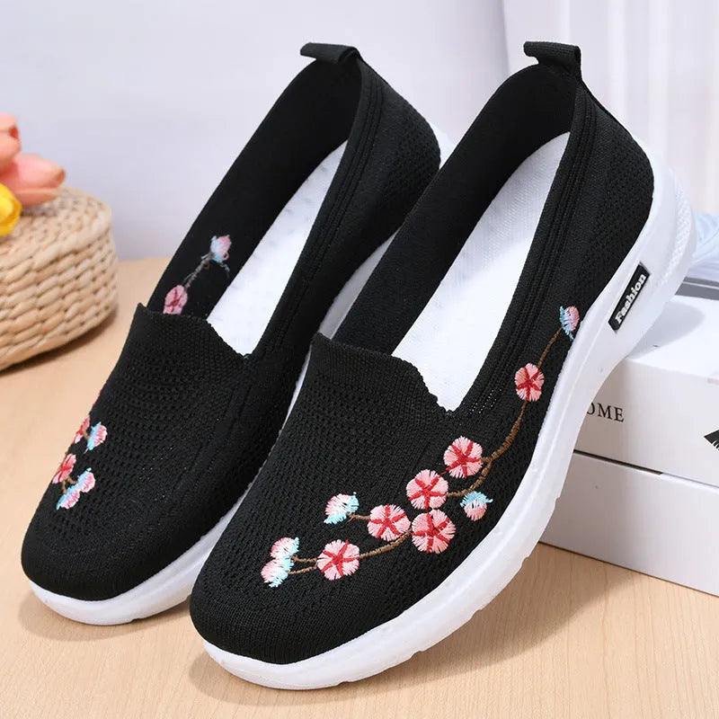 Women's embroidered woven sports pumps in wine red with a low flat heel and round toe.