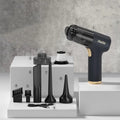 Black wireless handheld car vacuum cleaner and inflator with multiple nozzle attachments