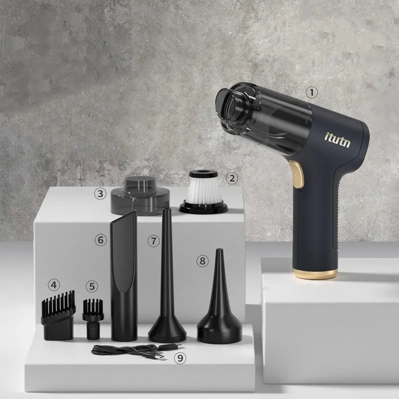 Black wireless handheld car vacuum cleaner and inflator with multiple nozzle attachments