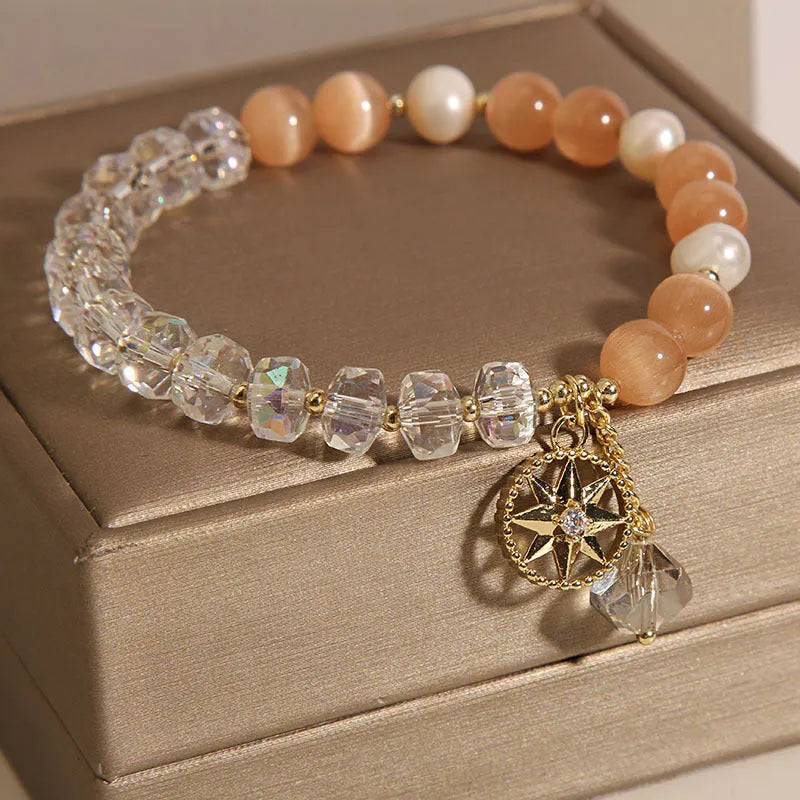 Orange opal crystal bracelet with gold-plated eight awn star design and artificial gemstone inlay