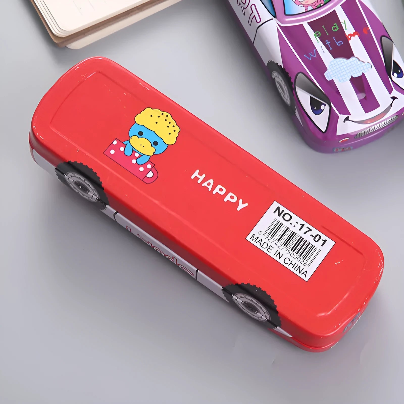 Tinplate car-shaped pencil case with cartoon patterns showing double-layer interior