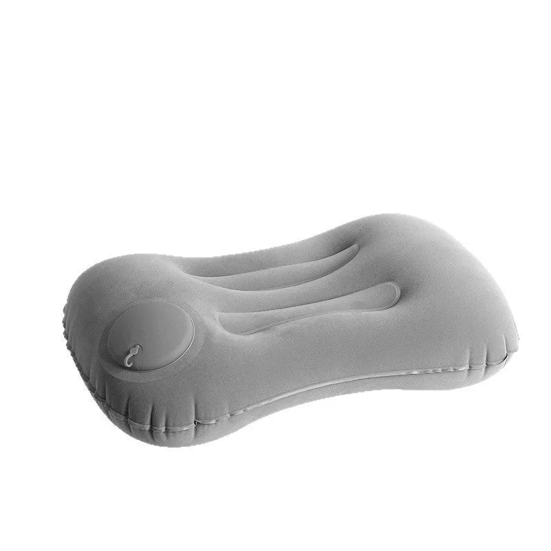 Grey inflatable travel pillow with flocking finish shown inflated to 45x30x13cm dimensions for neck support