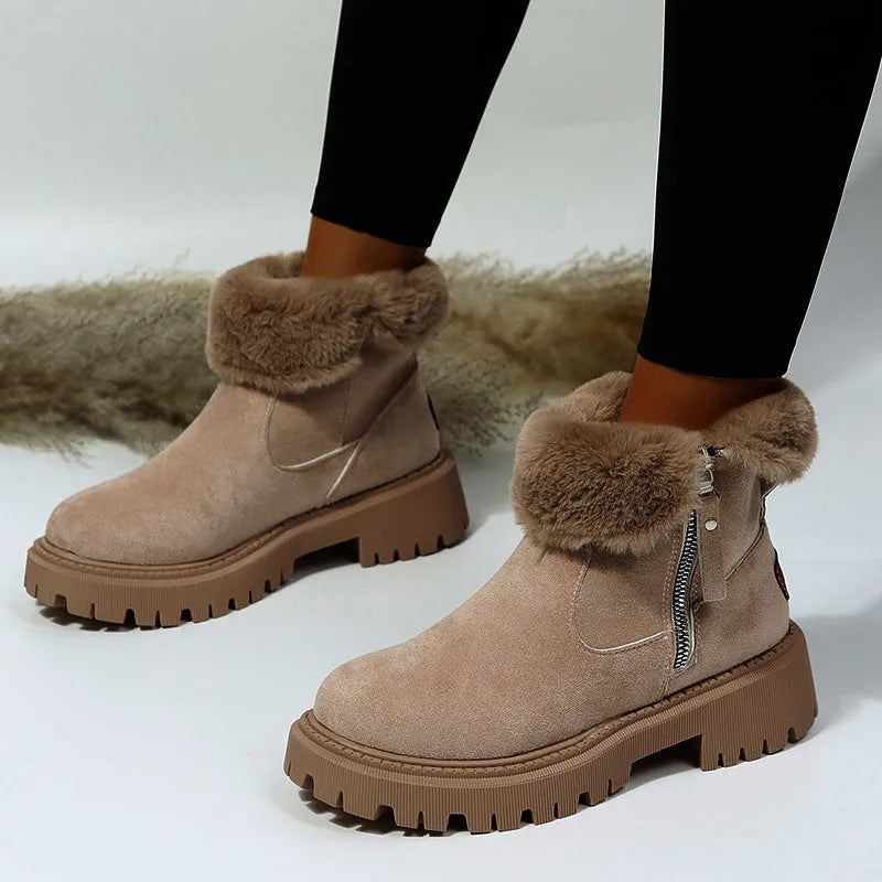 Women's black high-top snow boots with a side zipper and round toe on a non-slip rubber sole.