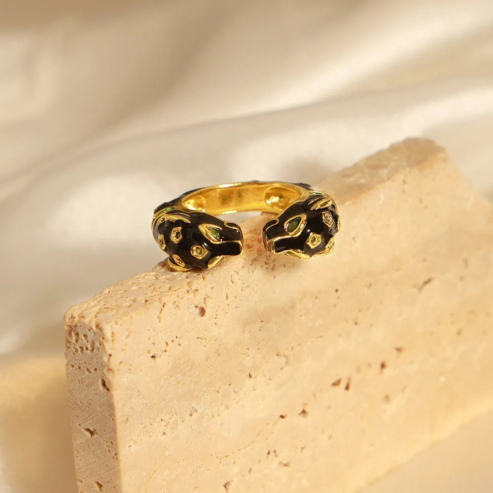 Women's geometric open ring with black electroplated cheetah drip pattern design, size 7