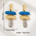 A pair of geometric multicolour stud earrings for women on a plain background.