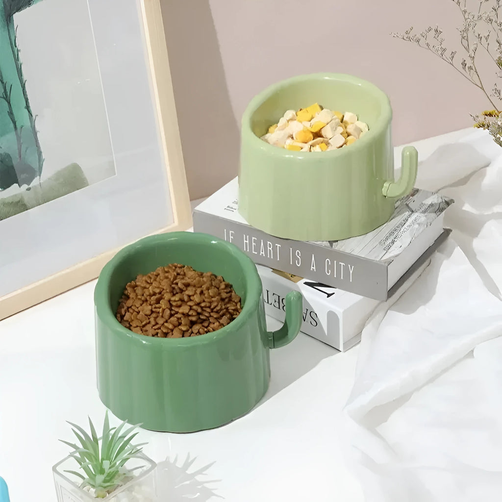 Green high-stand cat bowl with cactus design and anti-slip base.