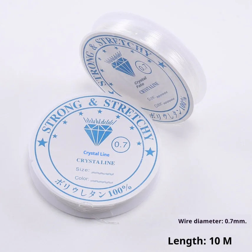 Clear white elastic fishing line on a spool for DIY jewellery making.