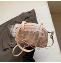 Women's PU leather handbag with bandage bow detail showing internal mobile phone pocket