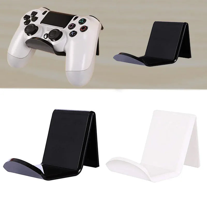 Universal game controller wall mount bracket in black plastic with gaming controller inserted