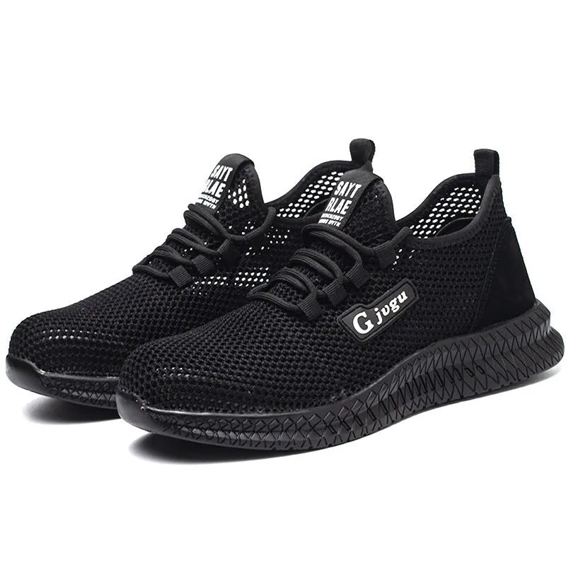 Men's black Flyknit low-top safety work shoe with a steel toe cap on a worksite background.