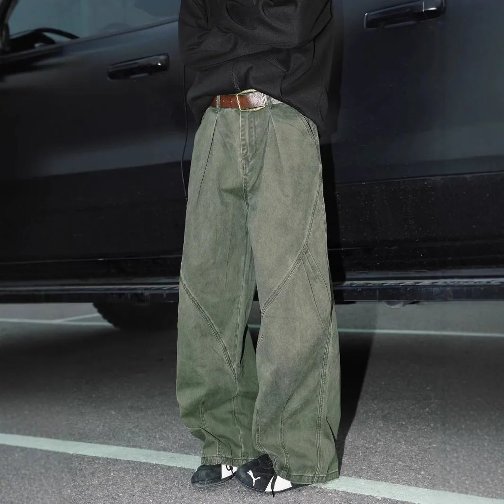 Men's loose straight-leg pleated trousers in apricot stripes on a mid-waist fit model.