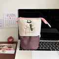 Brown and green cartoon design collapsible pencil case made from oxford fabric.