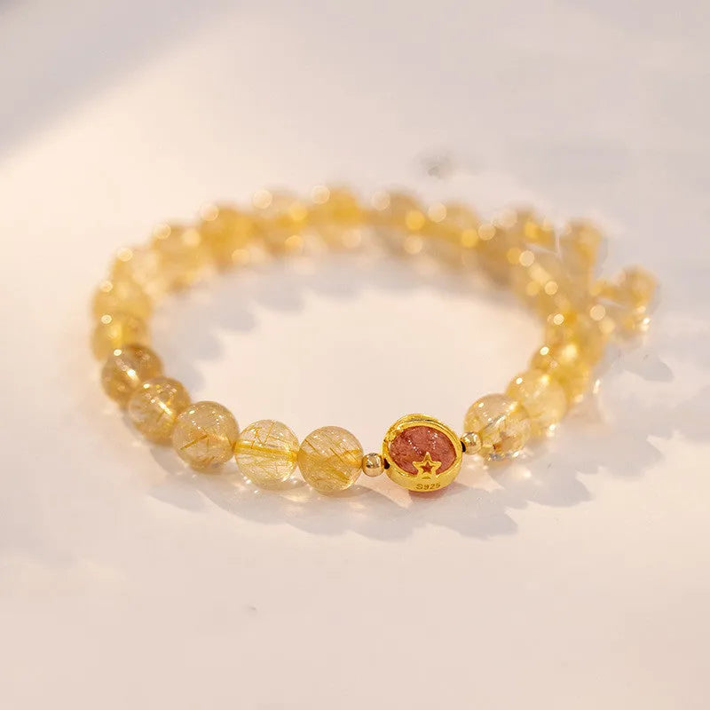 Gold rutilated quartz crystal bracelet with diamond cut stones in unisex Korean style design