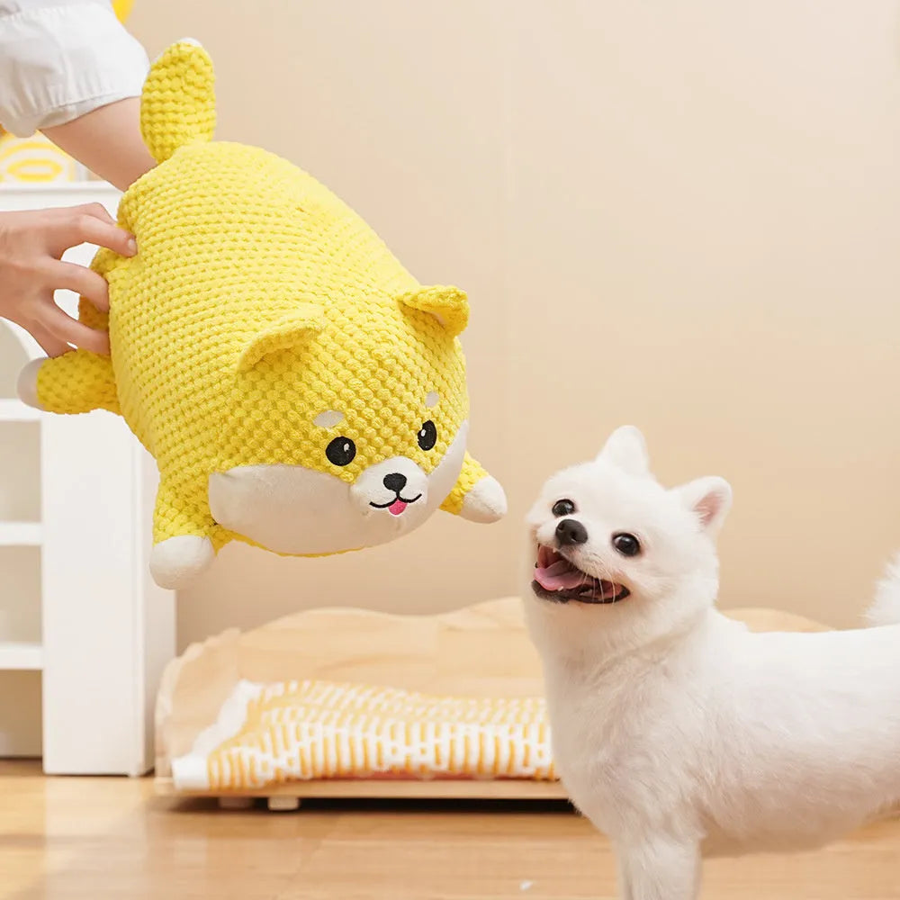 Large and medium sized plush calming dog toy with squeaker and textured chew fabric.