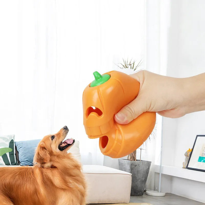 Orange Halloween pumpkin shaped interactive dog chew toy with treat-dispensing funnel