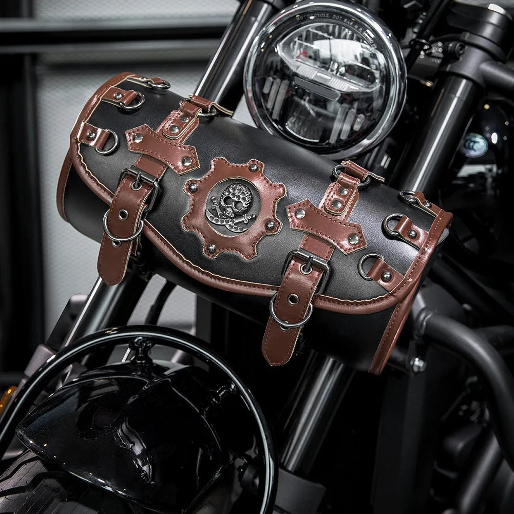 Black PU motorcycle pannier bag with punk retro styling mounted on a bike.