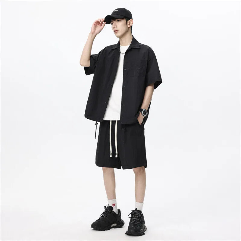 Men's dark grey loose shorts and casual shirt two-piece set made from hemp-blend fabric.