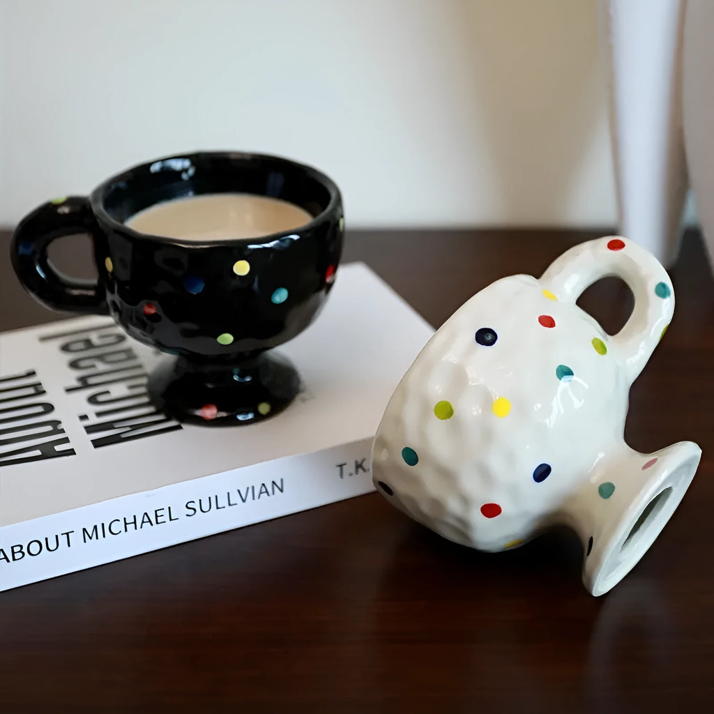 Hand-pinched irregular shaped ceramic mug in a solid colour, showing its unique handmade form.