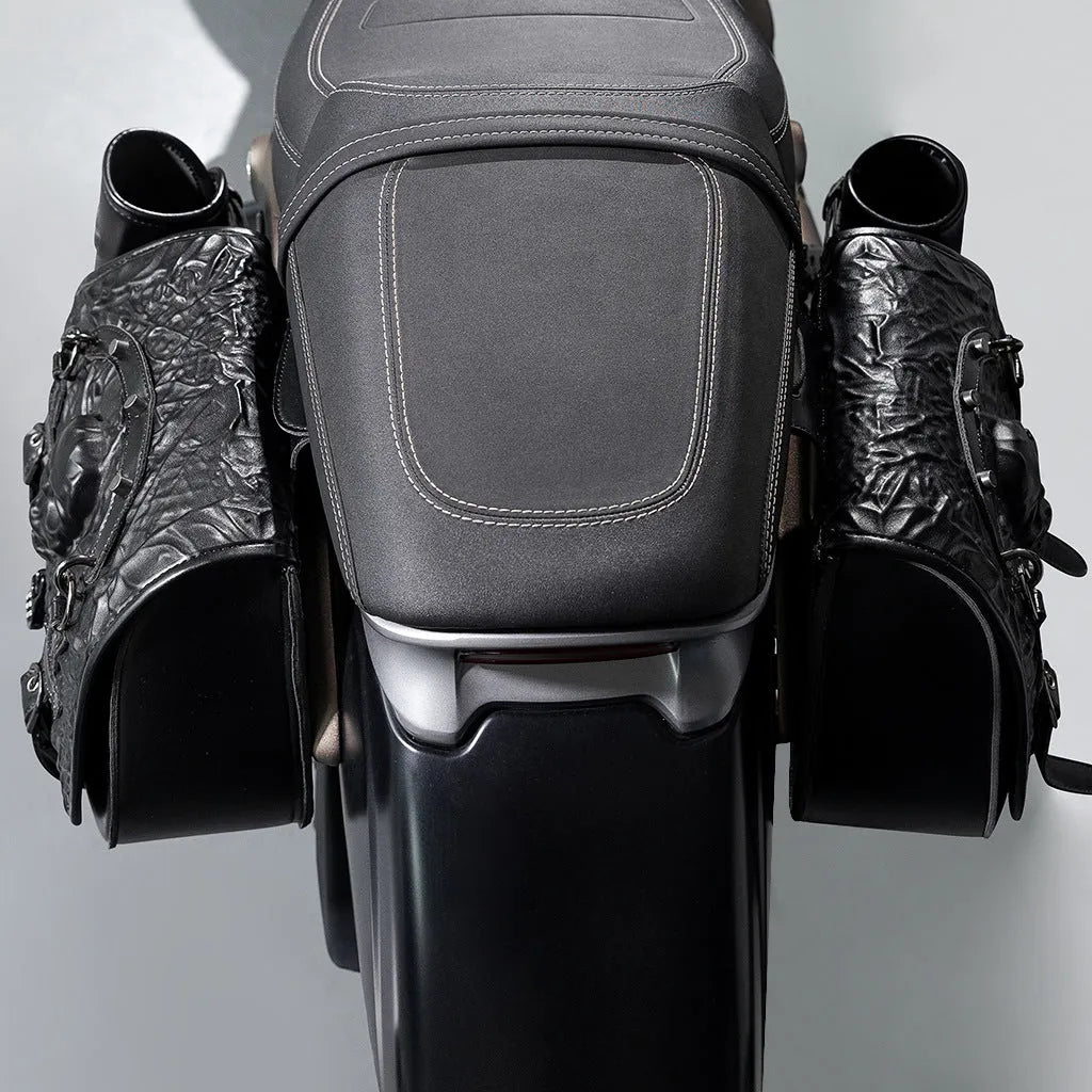 Pair of black PU motorcycle side luggage bags, model FBG404BK, mounted on a motorcycle.