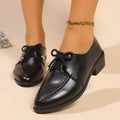 Women's beige PU leather slip-on shoes with a large bow decoration and rubber sole.