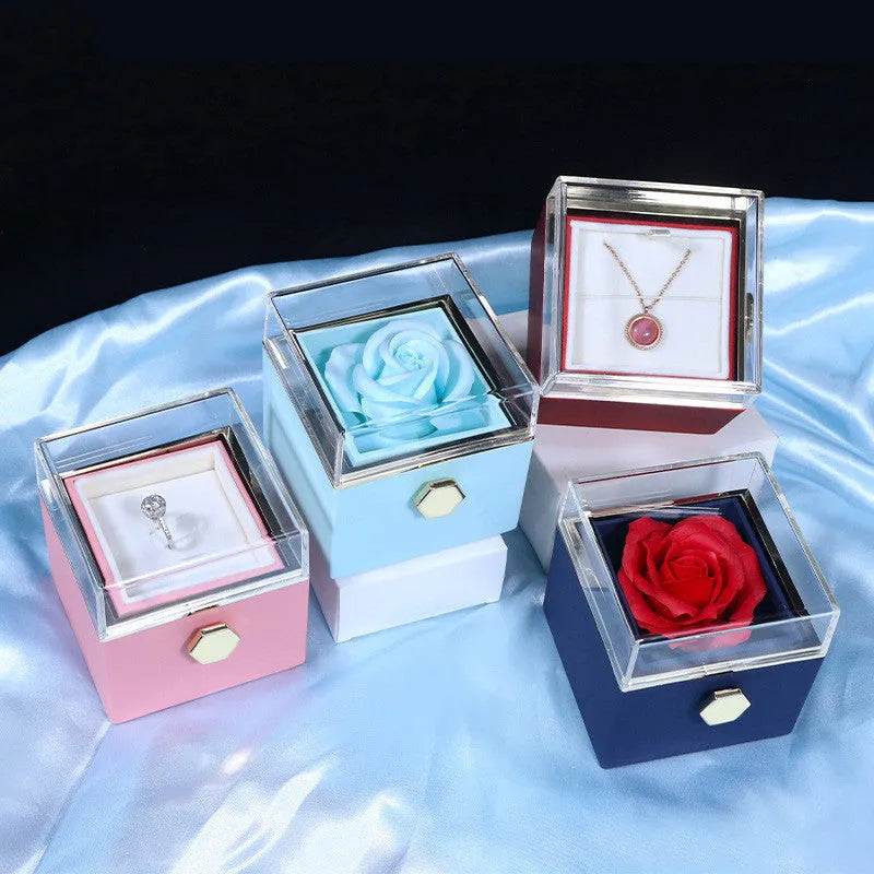 Rotating rose jewellery gift box with acrylic transparent cover showing preserved rose and rotating drawer open.