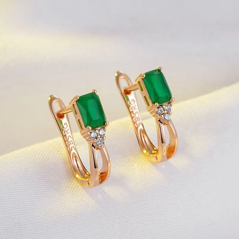 Rose gold tone square stud earrings with green zircon detail, copper piercing material, one pair