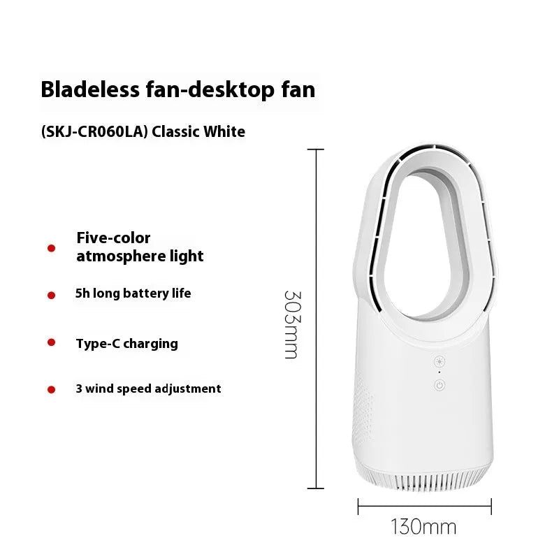 White bladeless tower fan with remote control placed on a desk next to a laptop.