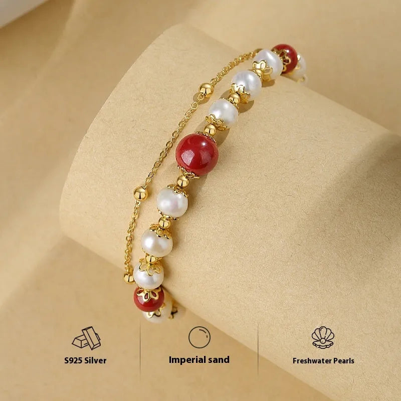 Sterling silver double-layer bracelet with white freshwater pearls and cinnabar red bean geometric design