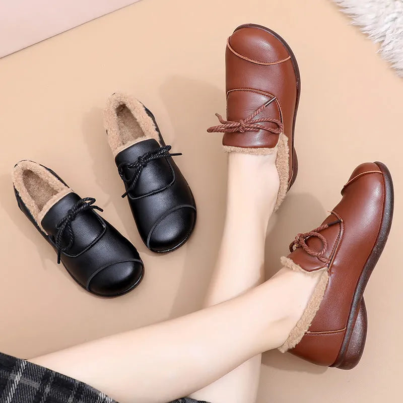 Black flat non-slip slip-on fleece-lined warm shoes with microfiber upper and round toe