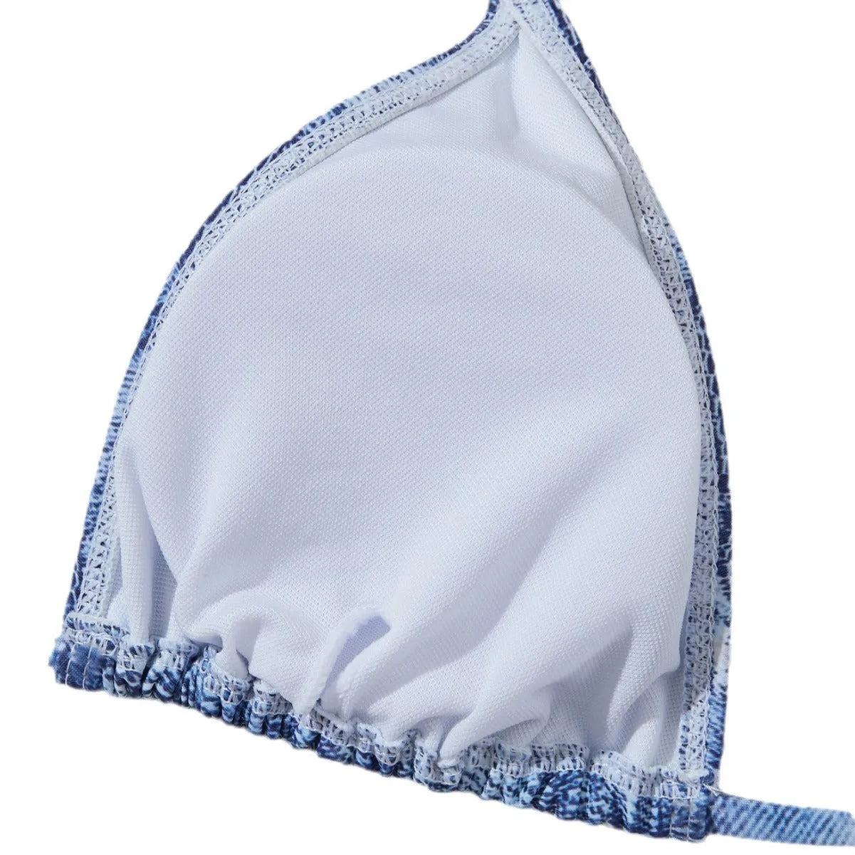 Denim blue printed women's bikini swimsuit with adjustable straps laid flat.
