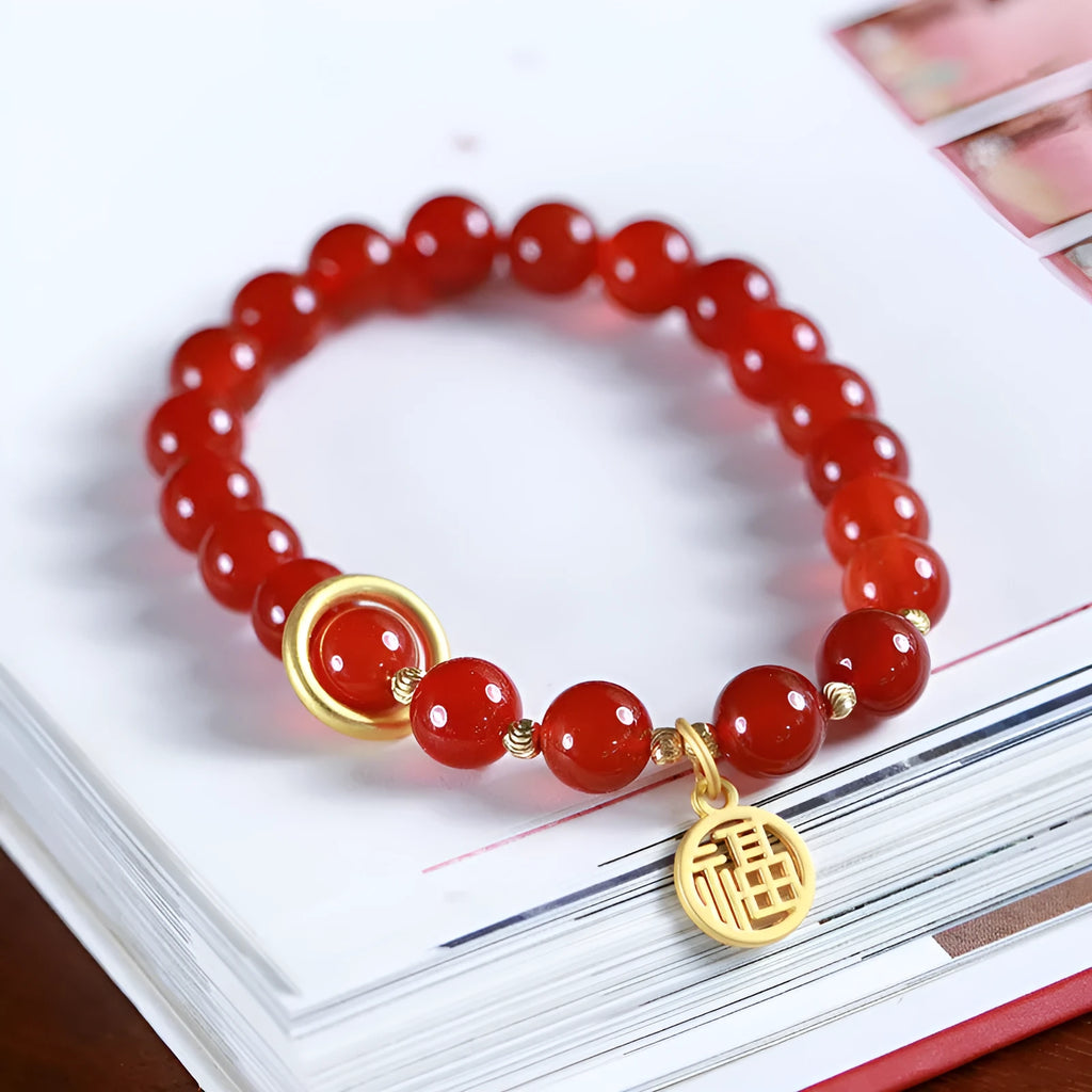 Handwoven natural red agate beaded bracelet with cultural style, shown with a blessing card.